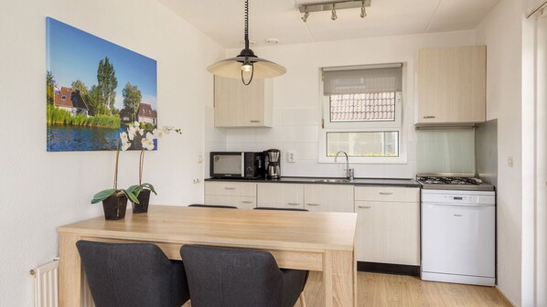 Fridge, coffee/tea maker, toaster, dining tables