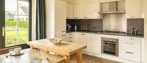 Microwave, cookware/dishes/utensils, dining tables