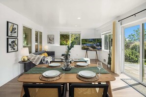 Experience the charm of this quaint dining area, where modern meets rustic for a memorable mealtime with loved ones