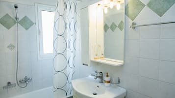 Shower, hair dryer, towels, shampoo