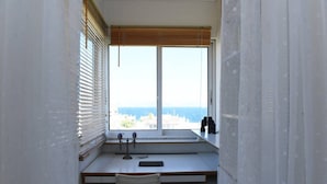 A small, private office with a desk, chair, and a large window with blinds. - Top floor 3bed 2bath with stunning 360 view (Athens)