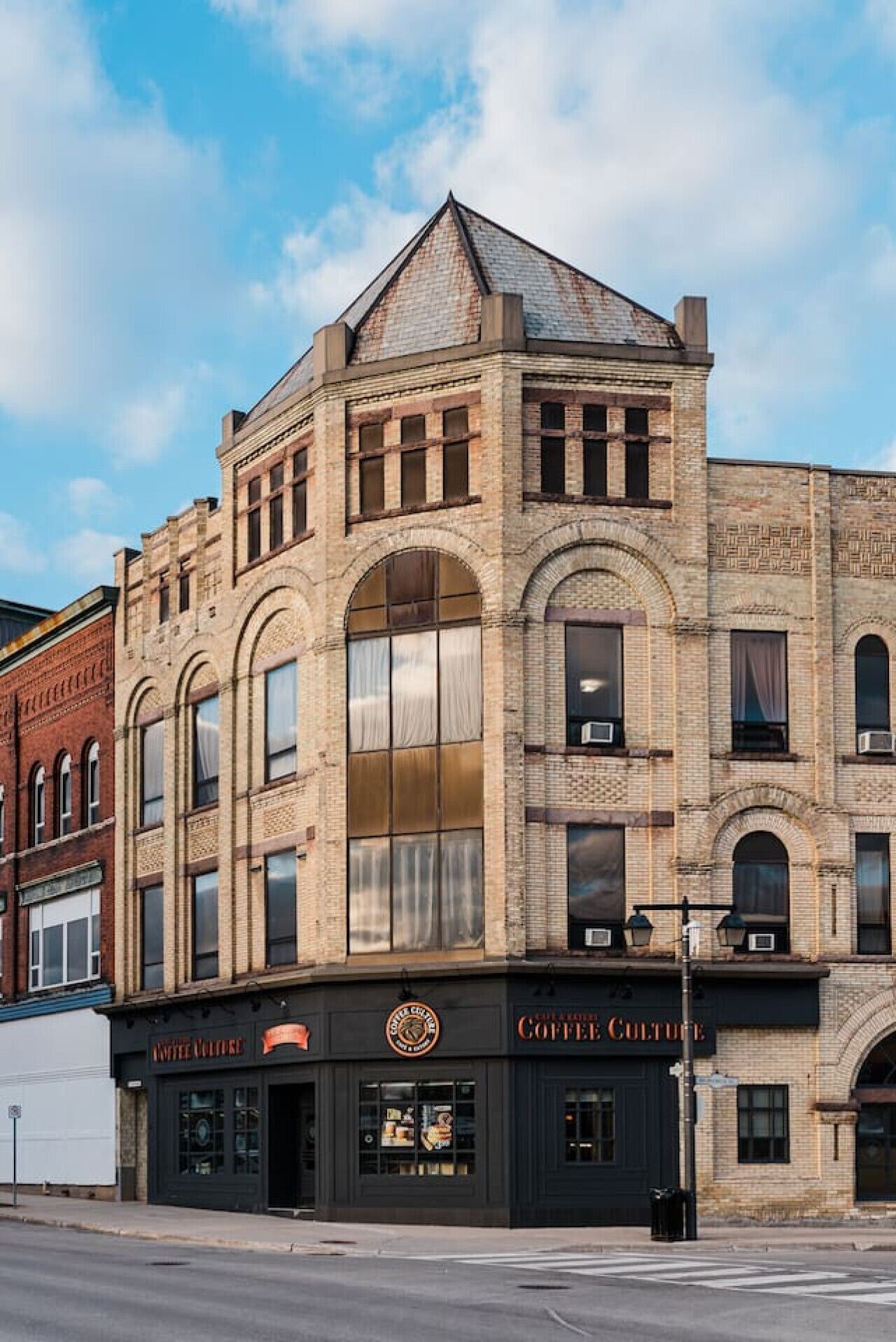 A historic building with a coffee shop on the ground floor.