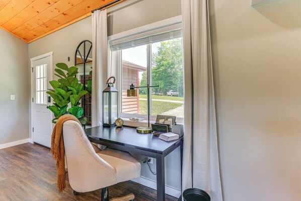 A home office with a desk, chair, and large windows. - [city] Farm w/ 120 Acres, Mtn & Water Views! (Damascus)