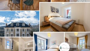 A modern hotel room with a bed, bedside table, and a view of a mountain. - Grande Anita - City center - Private parking (Barcelonnette)