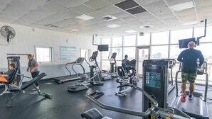 A fitness center with treadmills, elliptical machines, and weight equipment. - Majestic Sun #412A | Beach Views & Fun On-Site Amenities! (Miramar Beach)