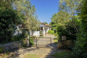 Set amidst lush greenery, this traditional home offers an and secure environment.