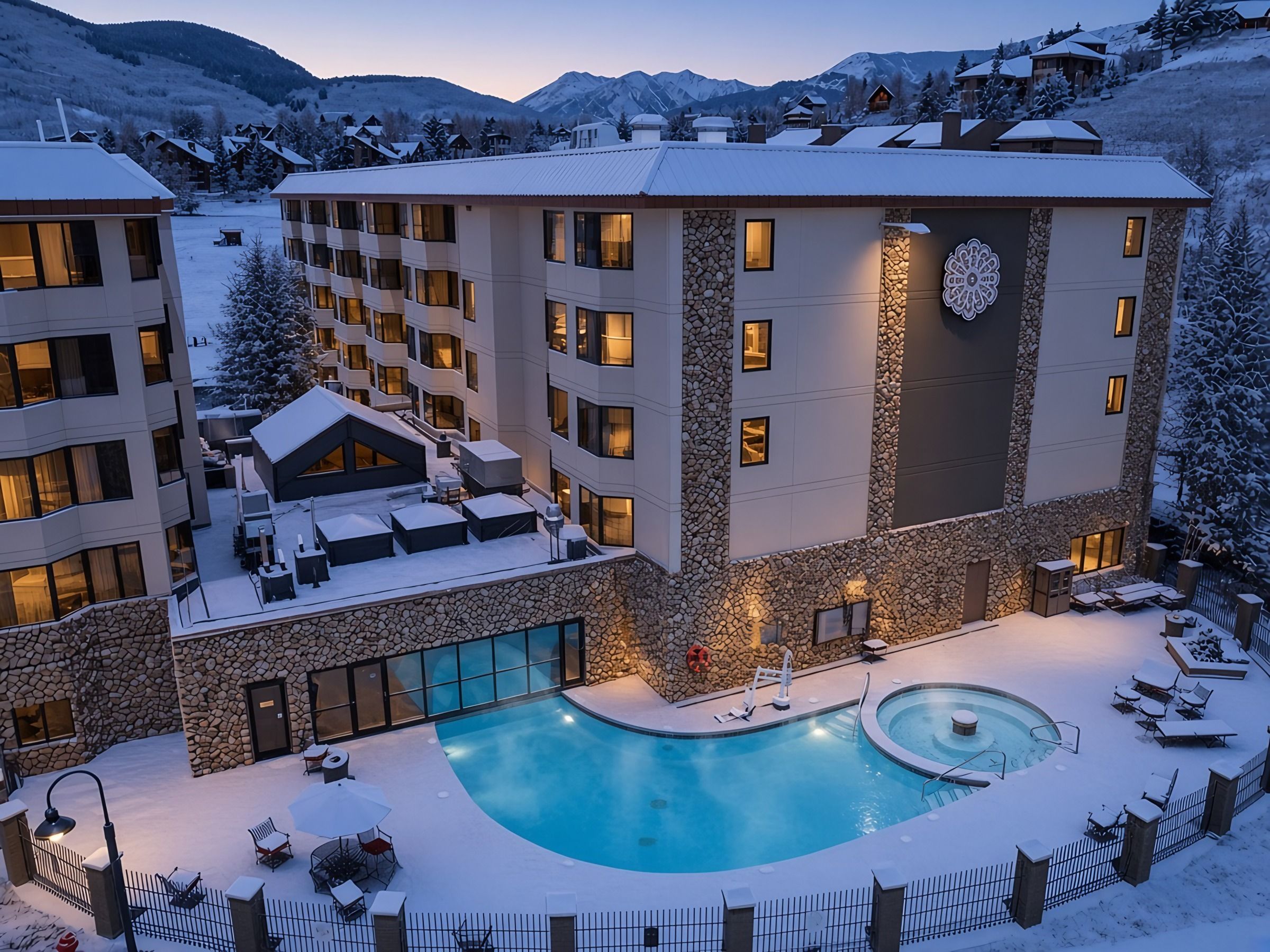 【Pool & Hot Tub — Winter Evening】Steam off the heated pool and hot tub as the lights come on at the base