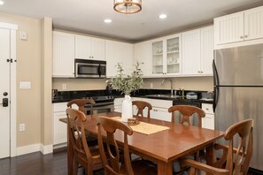 Enjoy cooking in this well-equipped kitchen with an oven, microwave, and refrigerator.