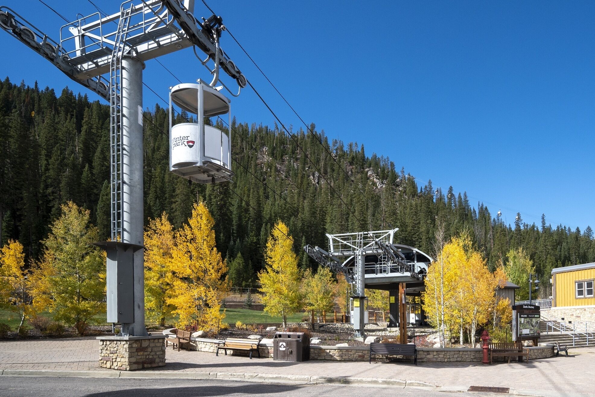 A ski lift with a cabin labeled "Winter Park" and a chairlift structure.