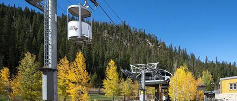 A ski lift with a cabin labeled "Winter Park" and a chairlift structure.