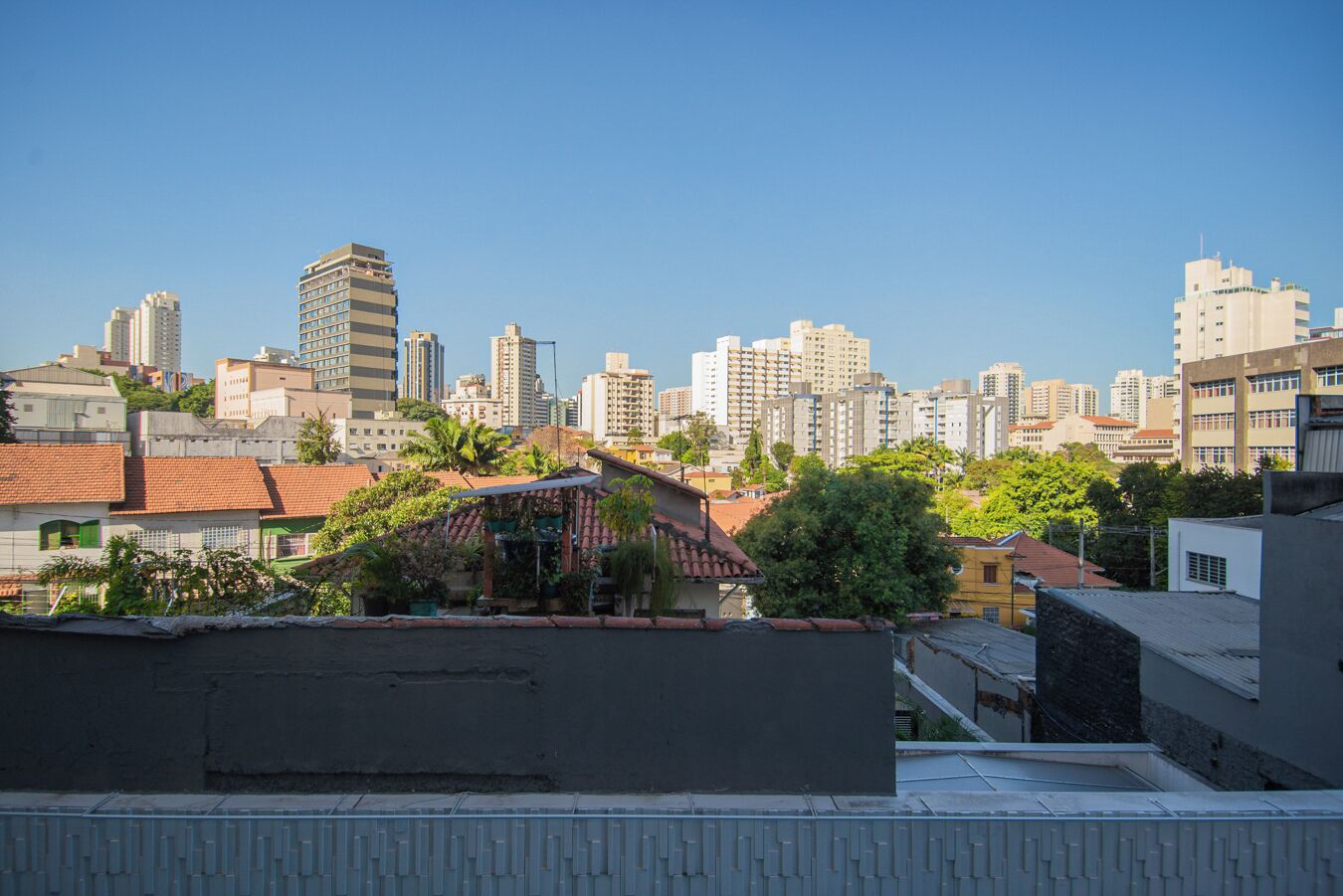 A cityscape with high-rise buildings and a mix of residential and commercial structures.