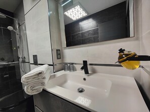 Hair dryer, towels, soap, shampoo