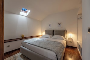 Apartment, City View | 2 bedrooms, desk, laptop workspace, iron/ironing board