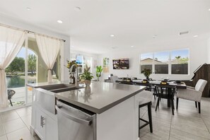 Fridge, microwave, oven, stovetop - Luxe Lakefront Villa: Saltwater Pool, Spa & Games (Indio)