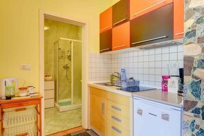 Fridge, toaster, cookware/dishes/utensils