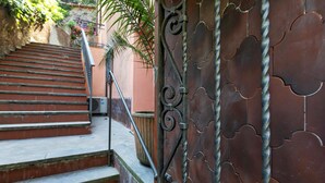 A staircase with a metal railing leading to a building entrance. - Comfy and Quiet in Camogli by Wonderful Italy (Camogli)