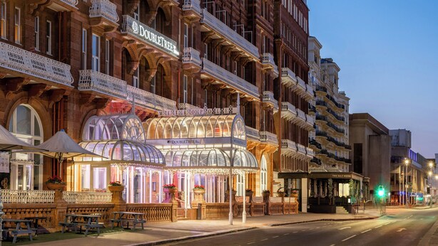 A historic building with ornate balconies and a marquee sign. - Doubletree By Hilton Brighton Metropole (Brighton)