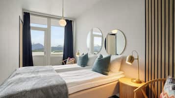 Apartment, Sea View | Down comforters, individually furnished, bed sheets