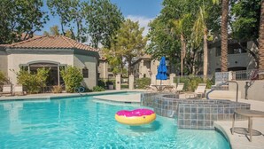 A swimming pool with a hot tub and lounge chairs. - Luxury Comfort close to Westworld & TPC + Pool&Spa (Scottsdale)