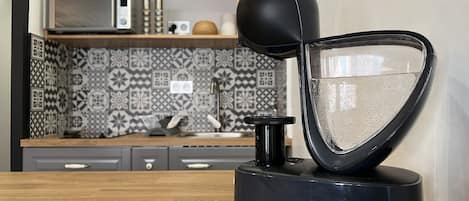 Coffee/tea maker, fridge, microwave, toaster