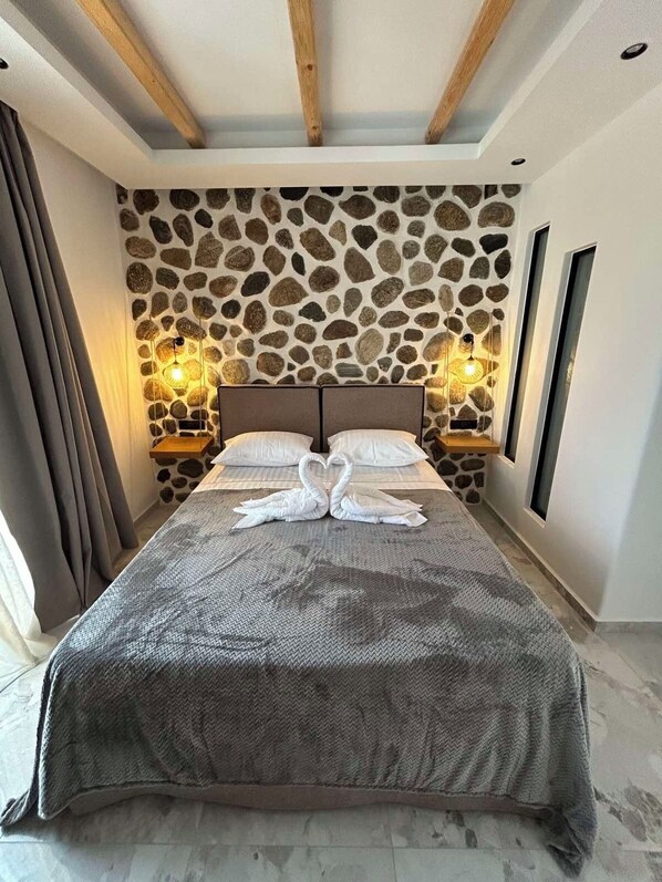 Apartament superior, vistes a l'oceà | 1 dormitori, roba de llit hipoal·lergògena i caixa forta a l'habitació