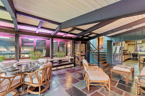 Spacious MCM home blends elegance w/ retro charm. Includes pool, steam and sauna