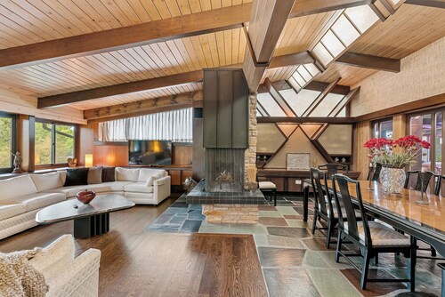 Spacious MCM home blends elegance w/ retro charm. Includes pool, steam and sauna