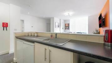 Fridge, microwave, oven, dining tables