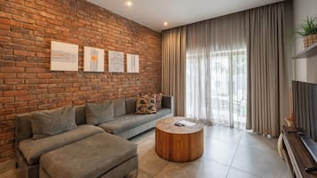 Apartment, 2 Bedrooms | Living area | 32-inch flat-screen TV with satellite channels