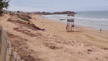 On the beach, sun loungers