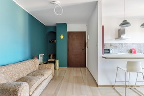 Condo | Living area | 35-inch flat-screen TV with digital channels - Sant'Isaia Apartment by Wonderful Italy (Bologna)