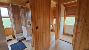 Shower, hair dryer, towels, toilet paper