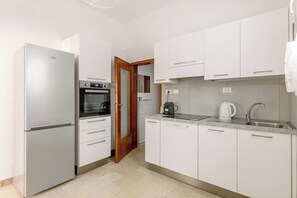 Apartment | Private kitchen | Fridge, oven, stovetop, dishwasher