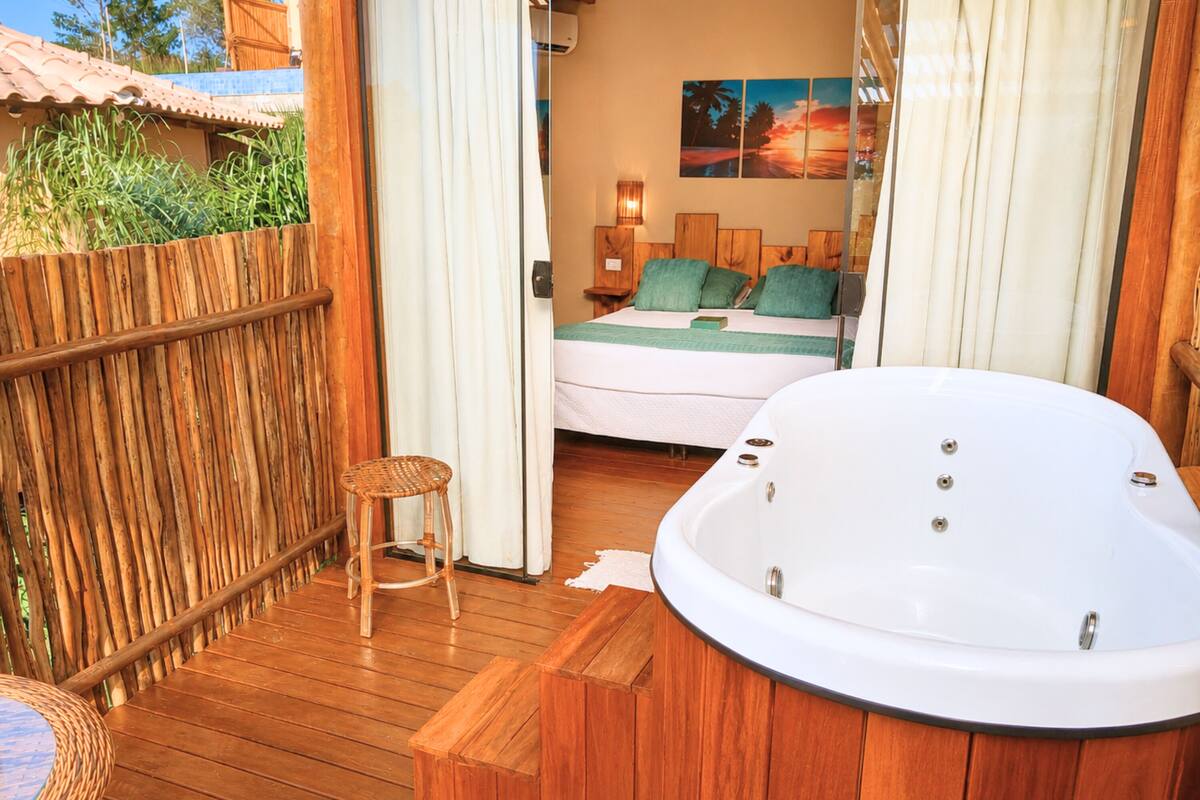 Deluxe Cabin, Hot Tub, Partial Sea View | Minibar, bed sheets