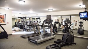 A gym with treadmills, elliptical machines, and weight equipment. - 1BR Condo | Free Breakfast + Indoor Pool (Fort Wayne)