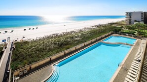 A swimming pool with a view of the beach and ocean. - Waters Edge 514 • Beachfront Balcony, Platinum Condo, Covered Prkg, Free Beach Service (Fort Walton Beach)