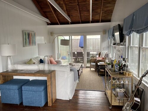 Bright airy Fair Harbor home with ocean views steps from the soft sandy beach 