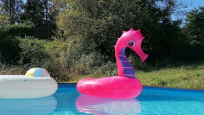 A swimming pool with inflatable toys, including a pink flamingo and a white and yellow float. - La Rena Quietness and serenity at 70 km from Nice (La Penne)