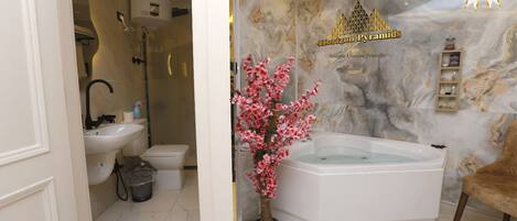 Jetted tub, hair dryer, towels, soap