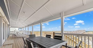 Outdoor dining - Modern Beach Front Home with Private Boardwalk | Alta Marea by Kaiser (Gulf Shores)