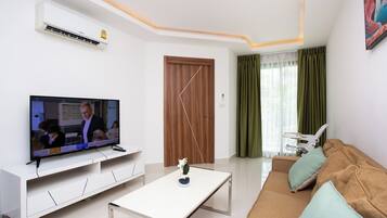 Family Apartment, Pool View | Living room | 49-inch Smart TV with digital channels