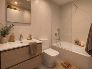 A modern bathroom with a shower, toilet, and vanity.