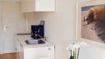 Fridge, microwave, stovetop, coffee/tea maker