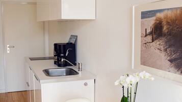 Fridge, microwave, stovetop, coffee/tea maker