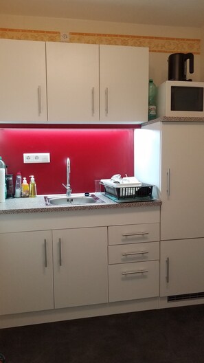 Fridge, microwave, stovetop, coffee/tea maker