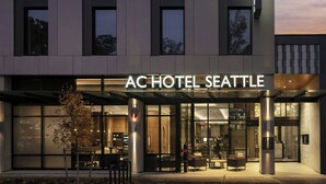The exterior of AC Hotel Seattle with a modern design, large windows, and a covered entrance area. - AC Hotel by Marriott Seattle Downtown (Seattle)