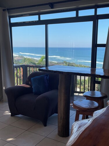 Wake up to gorgeous sunrises and sea views upon a wooden balcony.