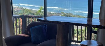 Wake up to gorgeous sunrises and sea views upon a wooden balcony.