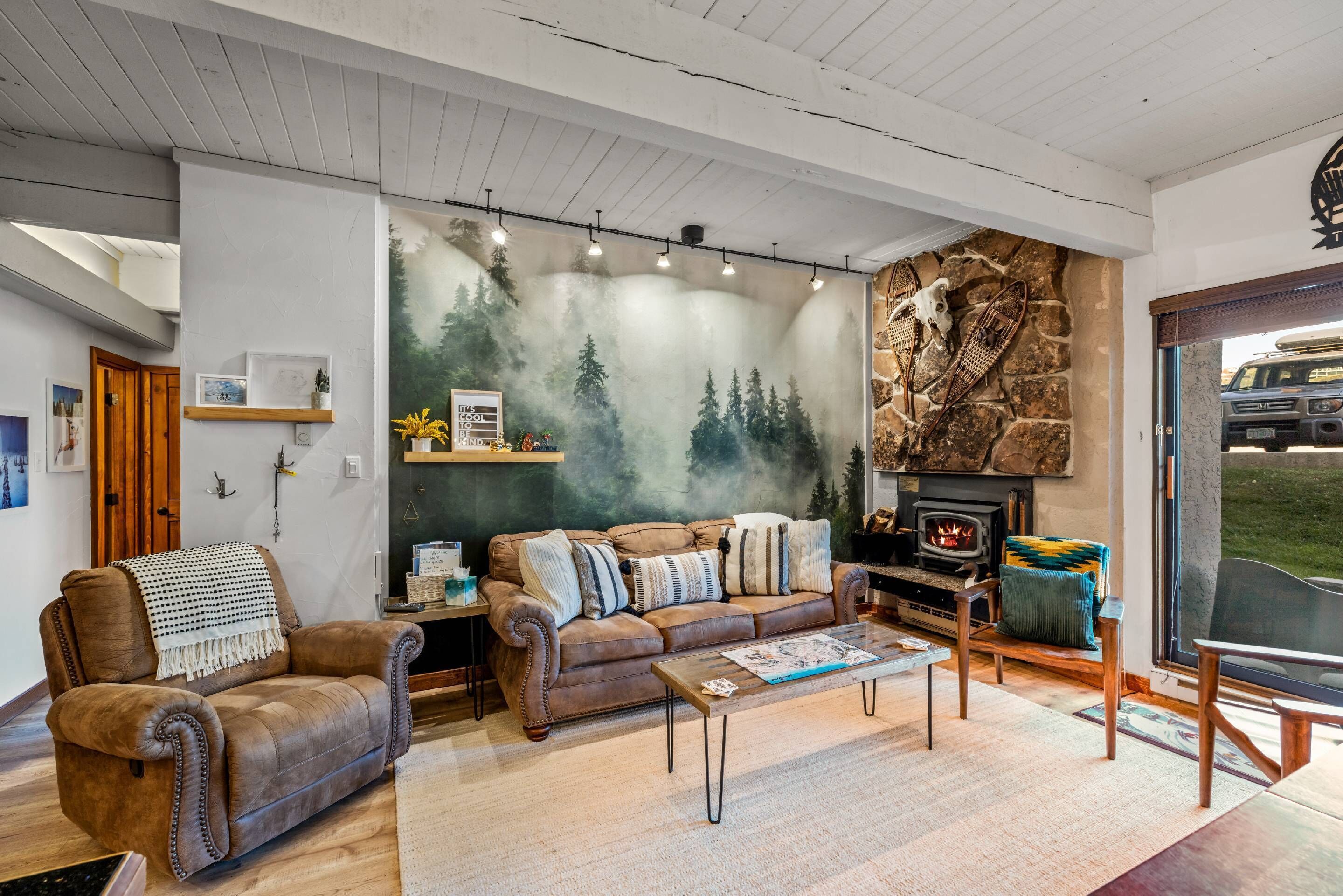 Cozy and fun decor in our living space, with wood burning fireplace.