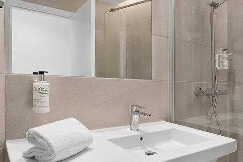 Bathtub, hair dryer, towels, soap
